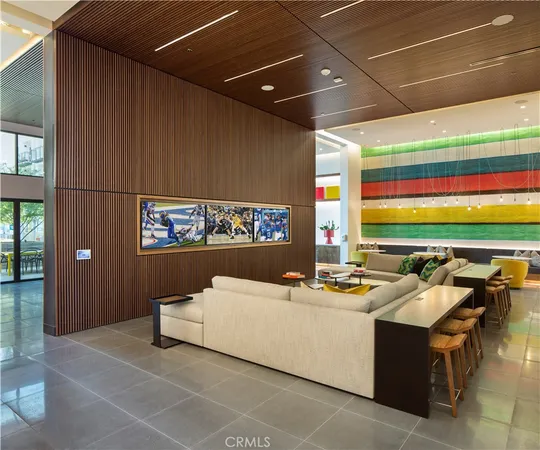 a living room with a couch and a chandelier