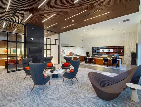 a kitchen with a dining table chairs and refrigerator
