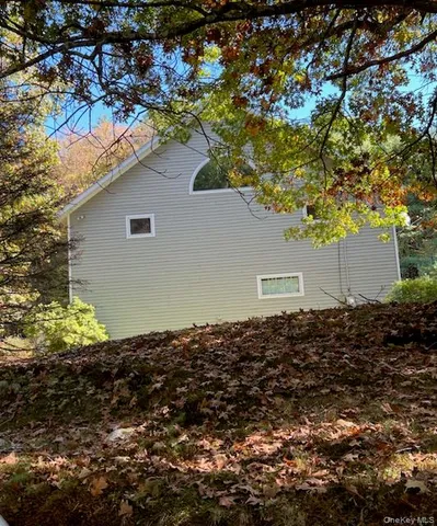 a backyard of a house with lots of green space