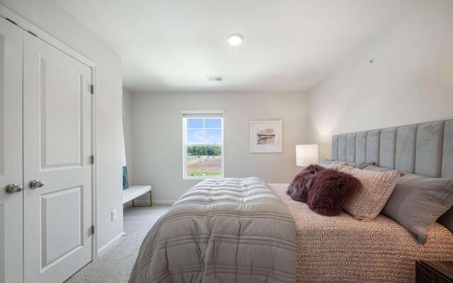 1380 Riverstone Road Jonesboro, GA 30238 - Photo 14 of 18 a bedroom with a bed and a window