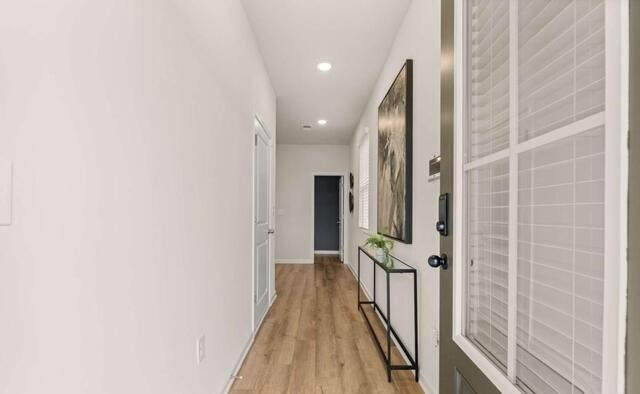 1380 Riverstone Road Jonesboro, GA 30238 - Photo 4 of 18 a view of a hallway with wooden floor and staircase