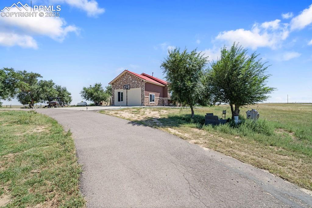 8450 Edison Road Yoder, CO 80864 - Photo 3 of 50 a view of house with yard