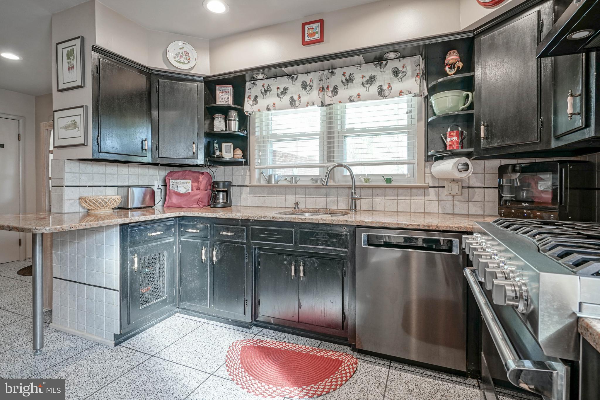 55 East Evesham Road Runnemede, NJ 08078 - Photo 15 of 45 a kitchen with stainless steel appliances granite countertop a sink stove and cabinets