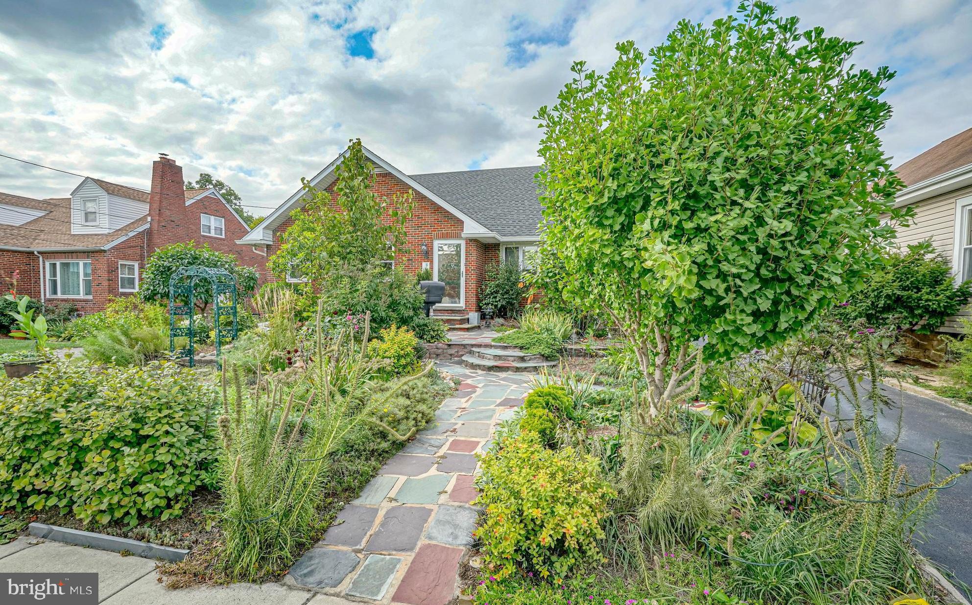 55 East Evesham Road Runnemede, NJ 08078 - Photo 41 of 45 a house view with a garden space