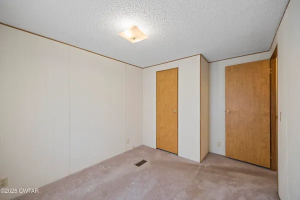 an empty room with a empty space and a window