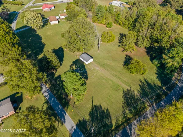 a view of a lake with a yard