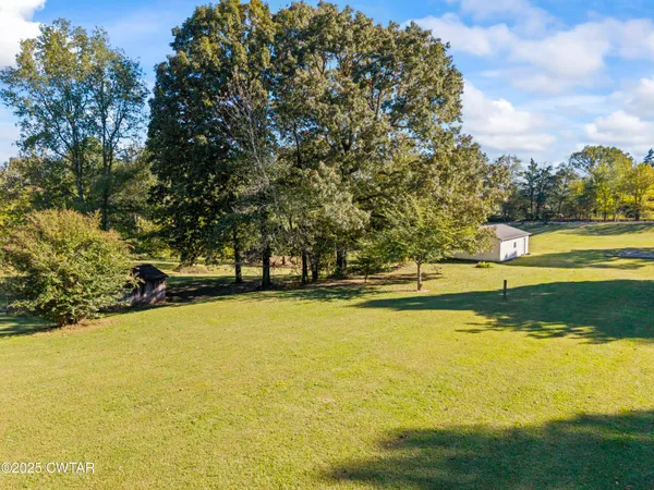 a view of a swimming pool with an outdoor space and seating area