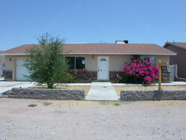 128 North Signal Butte Road Apache Junction, AZ 85120 - Photo 1 of 6 a house view with a outdoor space