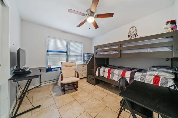 a bedroom with furniture and a window