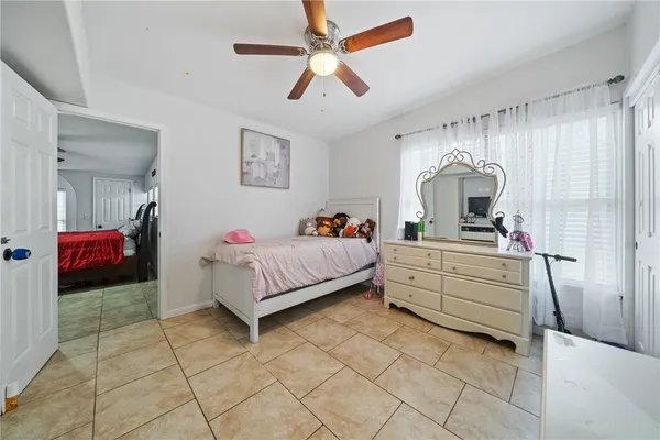 a bed room with a bed and a chandelier