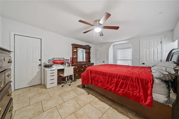 a bed room with a bed and a window