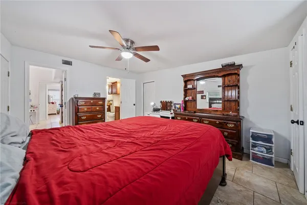 a bed room with a bed and a television