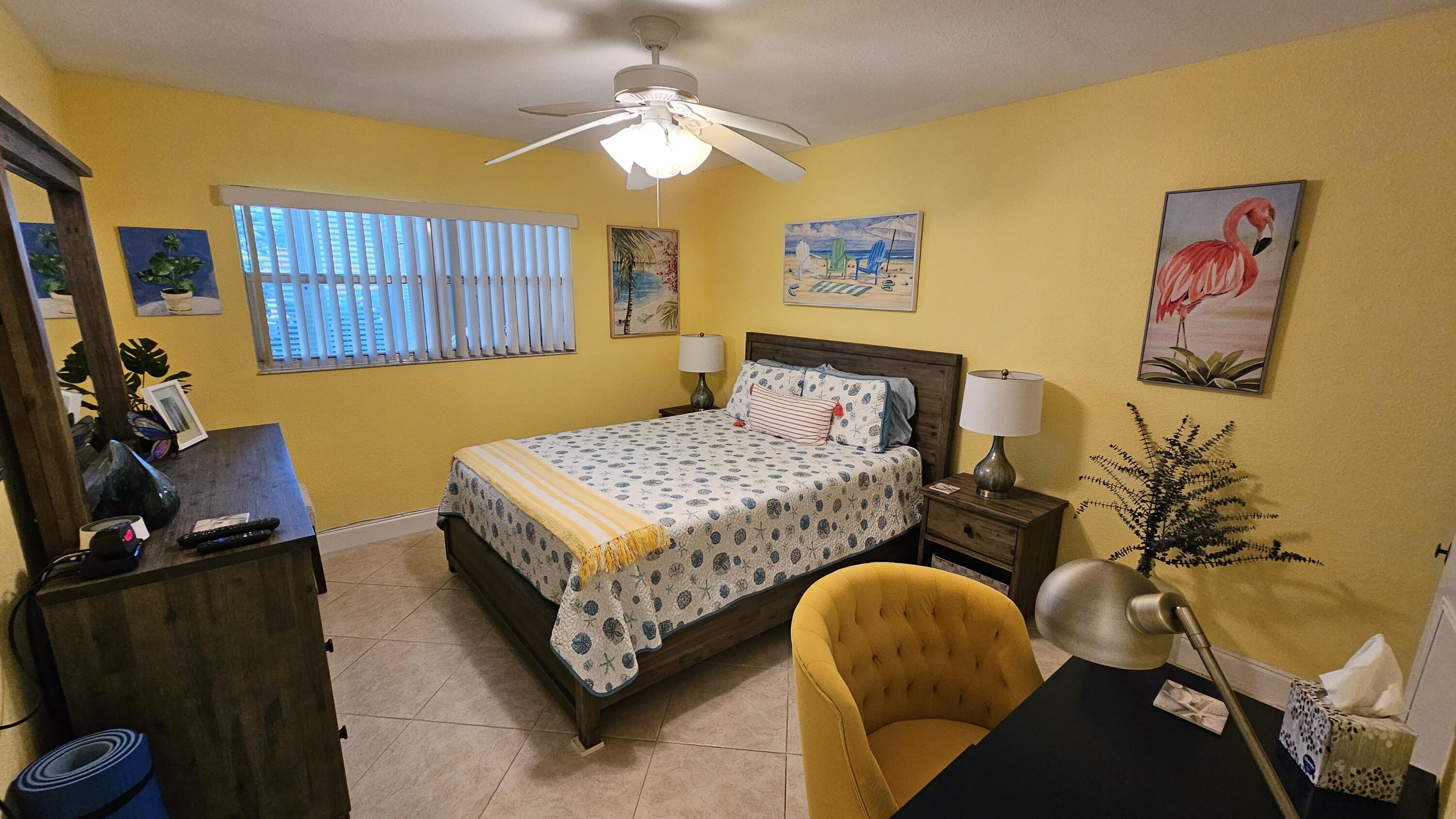 256 Seville K Delray Beach, FL 33446 - Photo 11 of 45 a bedroom with a bed and window