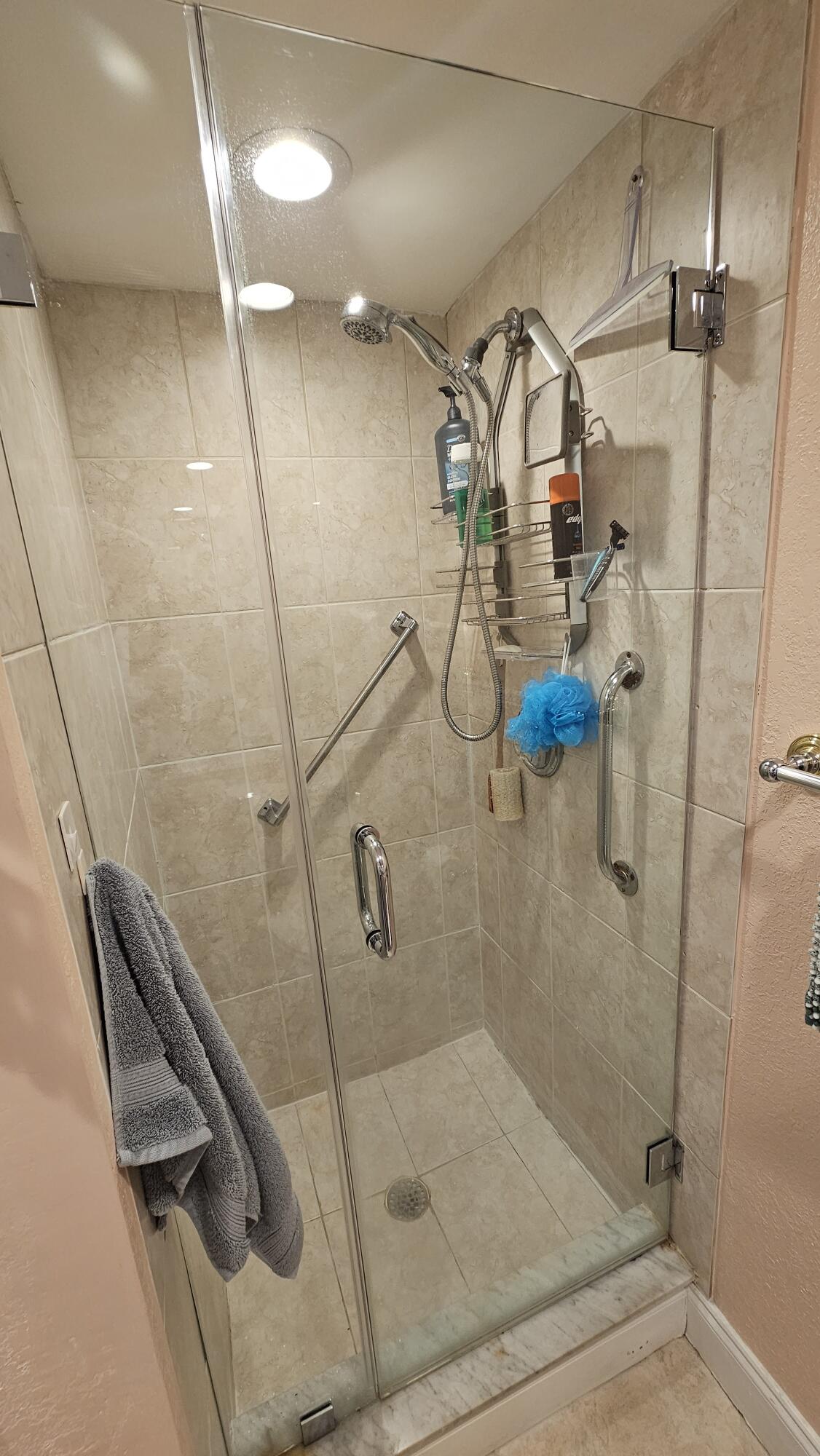 256 Seville K Delray Beach, FL 33446 - Photo 13 of 45 a bathroom with a shower