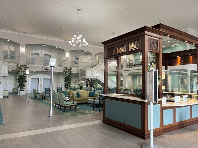 256 Seville K Delray Beach, FL 33446 - Photo 26 of 45 a view of a big room with furniture and a chandelier