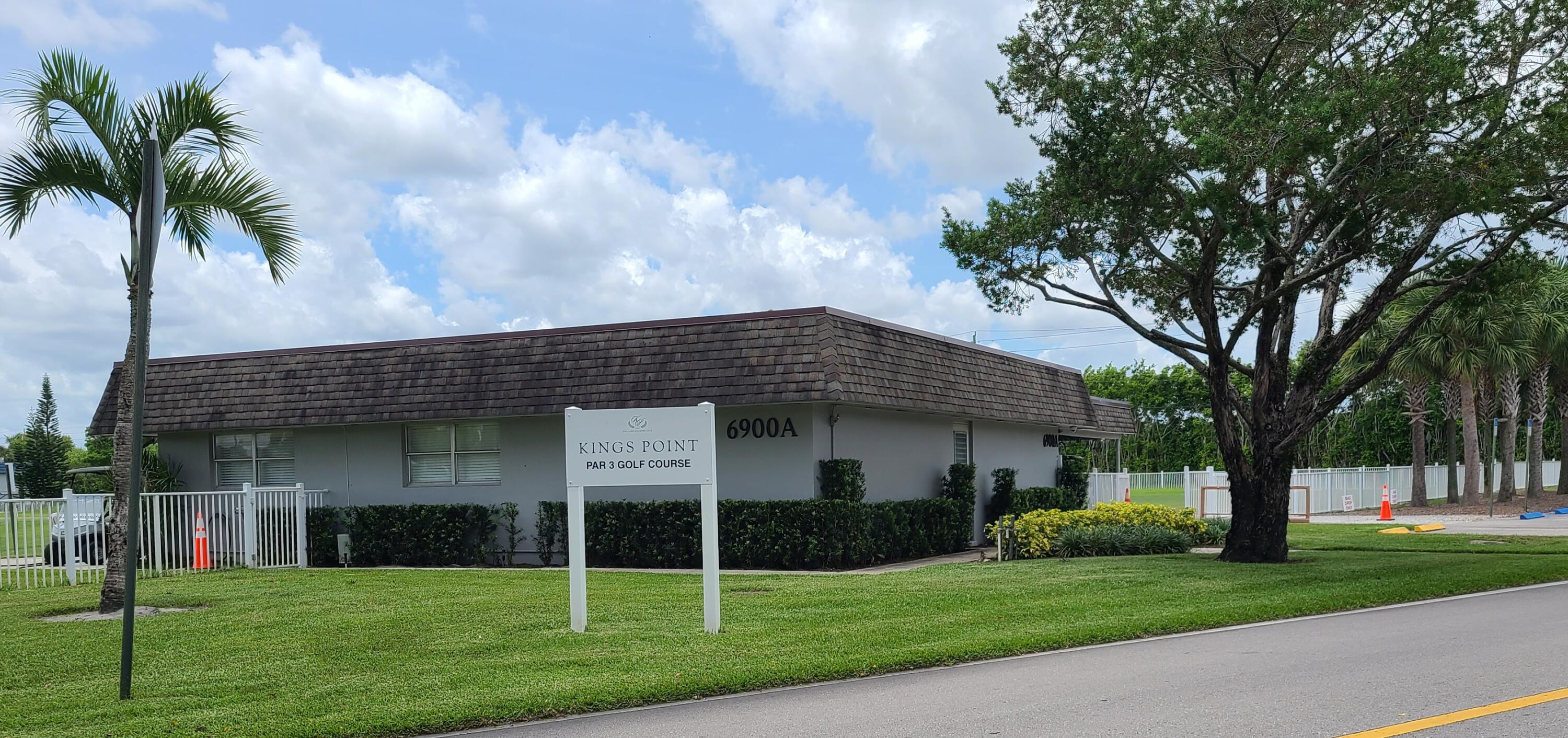 256 Seville K Delray Beach, FL 33446 - Photo 39 of 45 a view of a brick house with a large trees