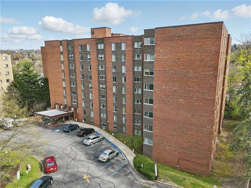 Well-maintained brick high-rise condominium offering a secure residential setting and classic exterior appeal.