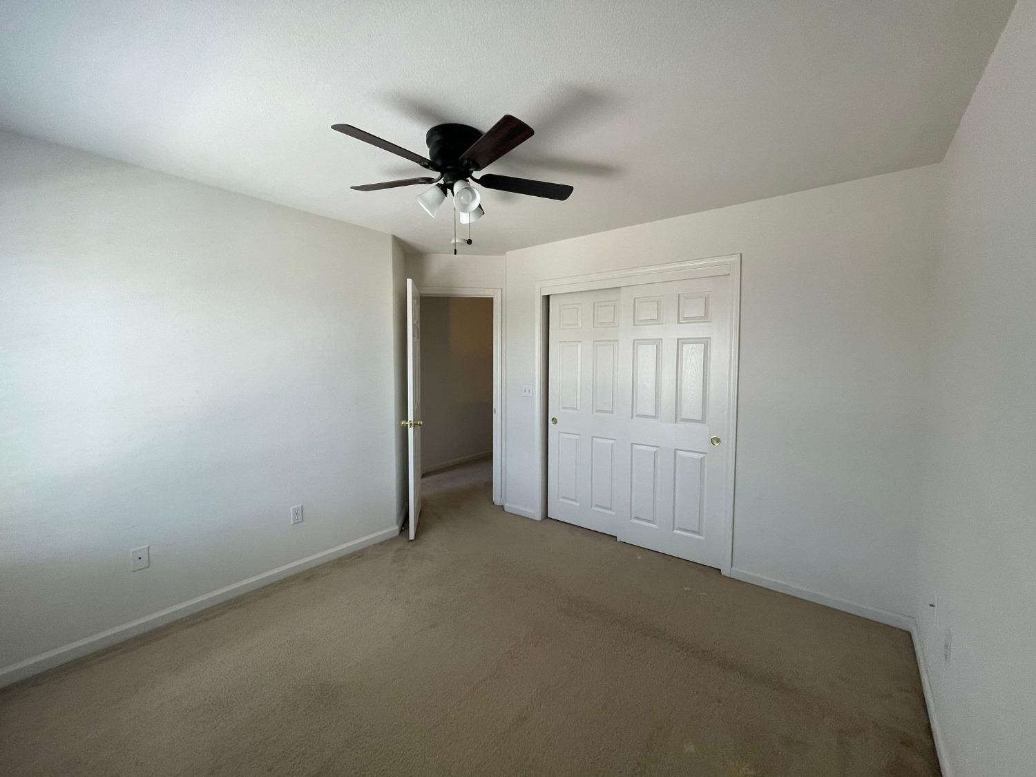 3123 Burgan Avenue Clovis, CA 93611 - Photo 15 of 26 a view of an empty room and a ceiling fan