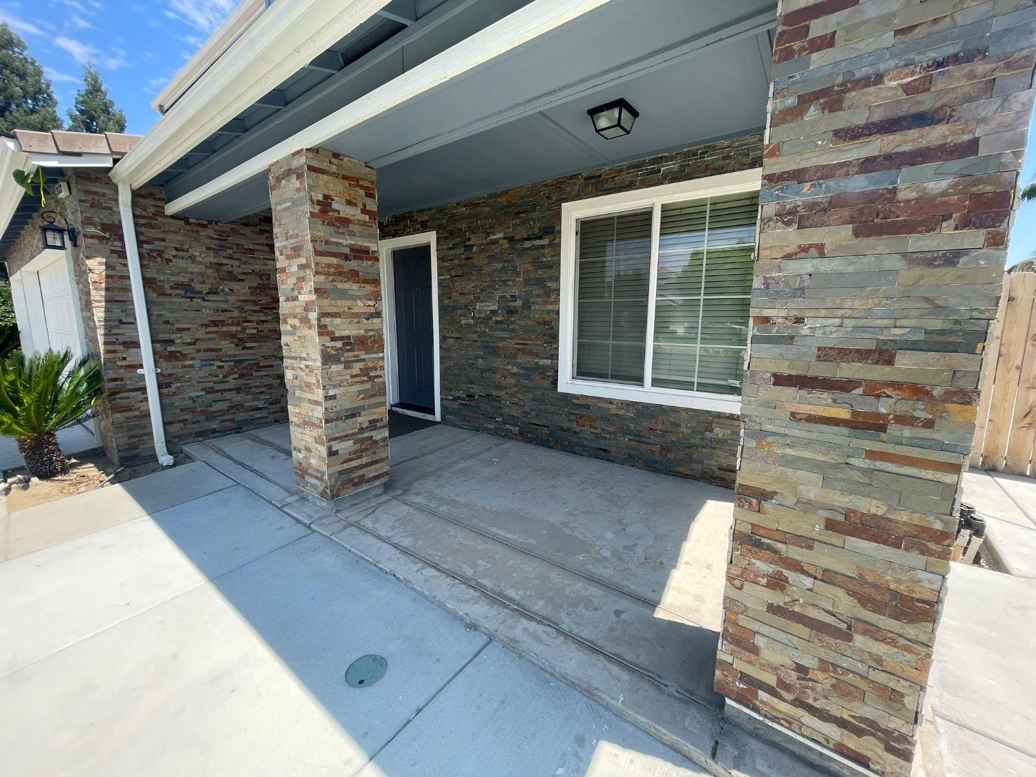 3123 Burgan Avenue Clovis, CA 93611 - Photo 22 of 26 a front view of a house with a large window