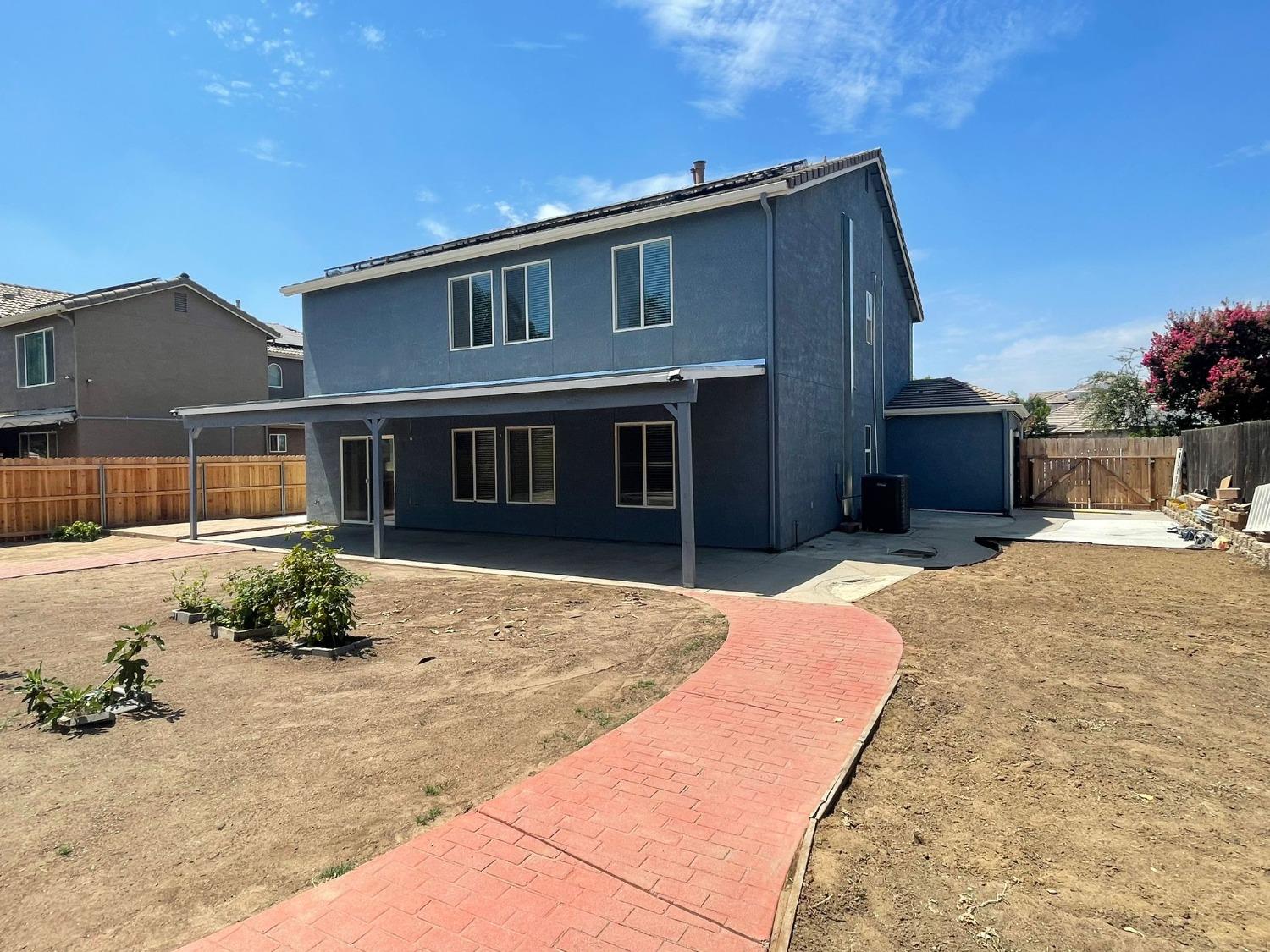 3123 Burgan Avenue Clovis, CA 93611 - Photo 24 of 26 a front view of a house with a yard