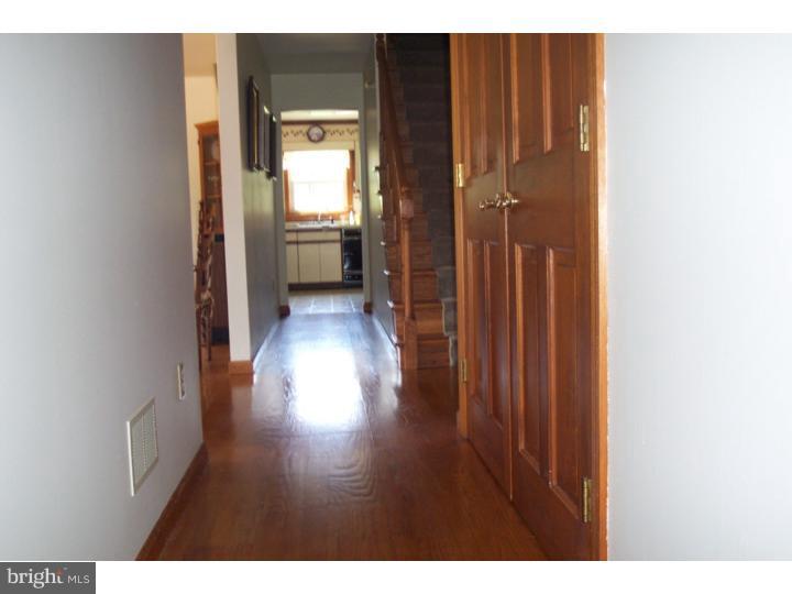 1249 Mink Road Perkasie, PA 18944 - Photo 11 of 18 a view of a hallway with wooden floor