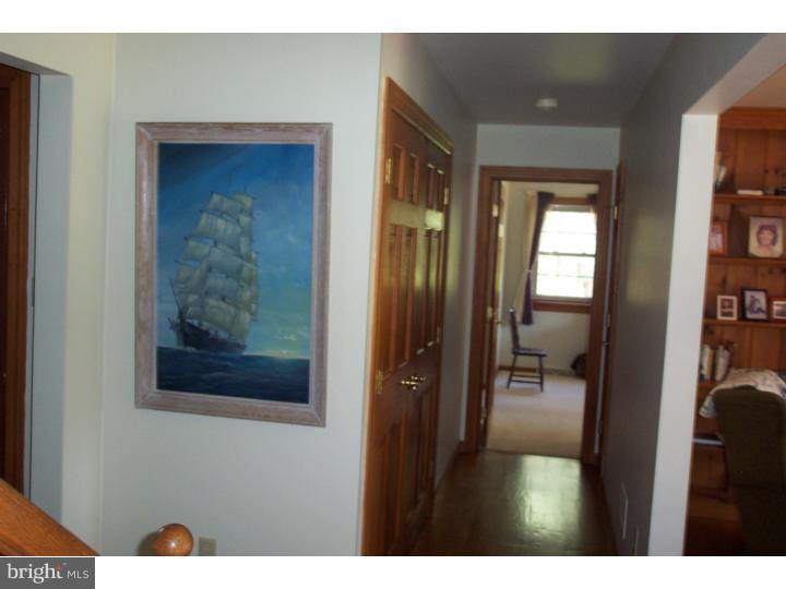 1249 Mink Road Perkasie, PA 18944 - Photo 13 of 18 a view of a hallway and a livingroom with furniture