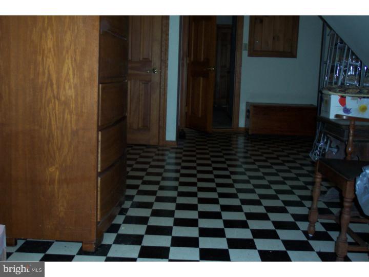 1249 Mink Road Perkasie, PA 18944 - Photo 14 of 18 a bathroom with a black and white checkered floor