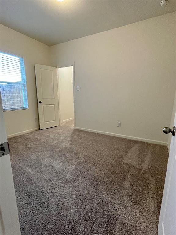 6222 Old Bridge Way Forney, TX 75126 - Photo 13 of 17 an empty room with windows