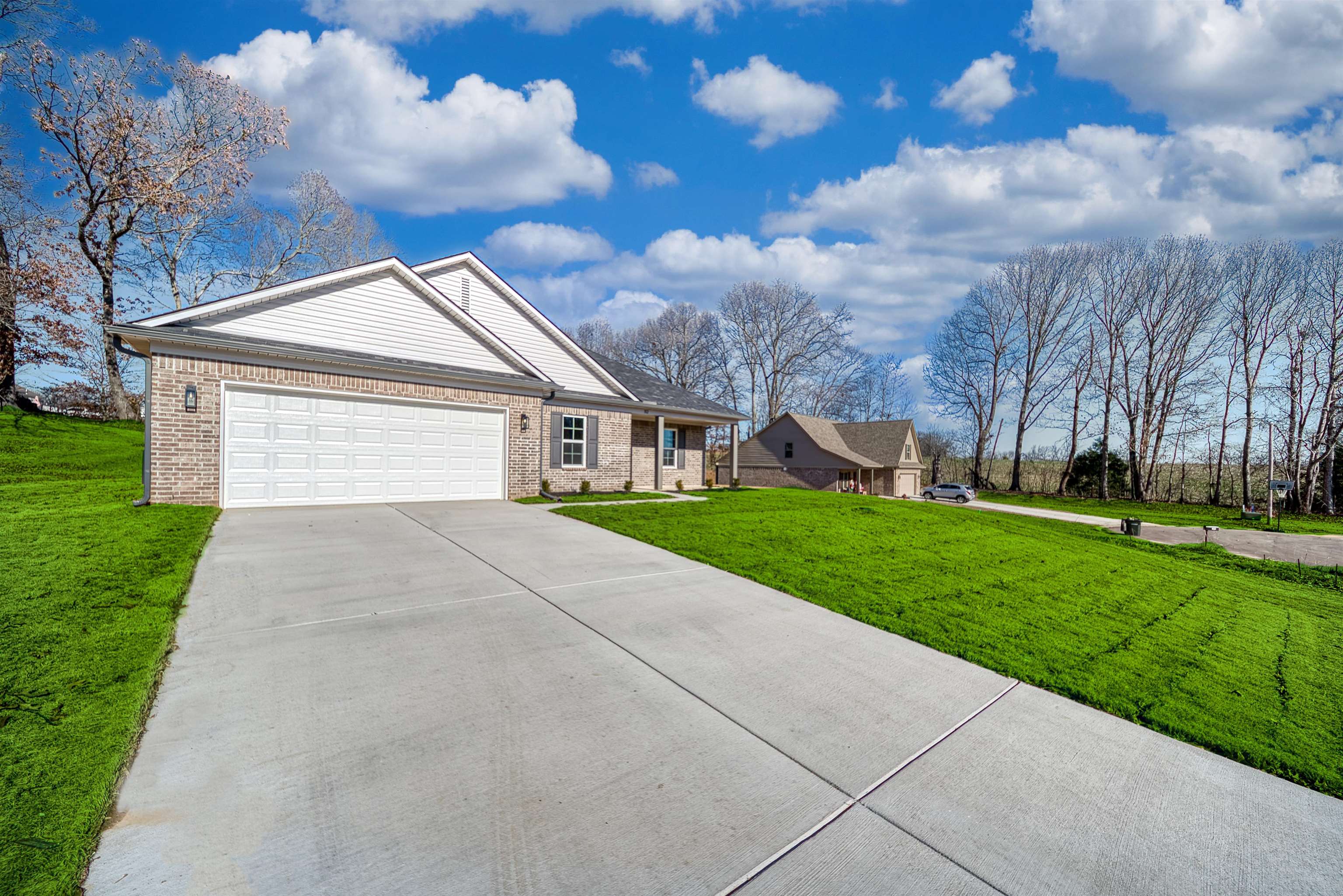 102 Stone Brook Cove Ripley, TN 38063 - Photo 7 of 32 Single story home with a front yard, driveway, and brick siding