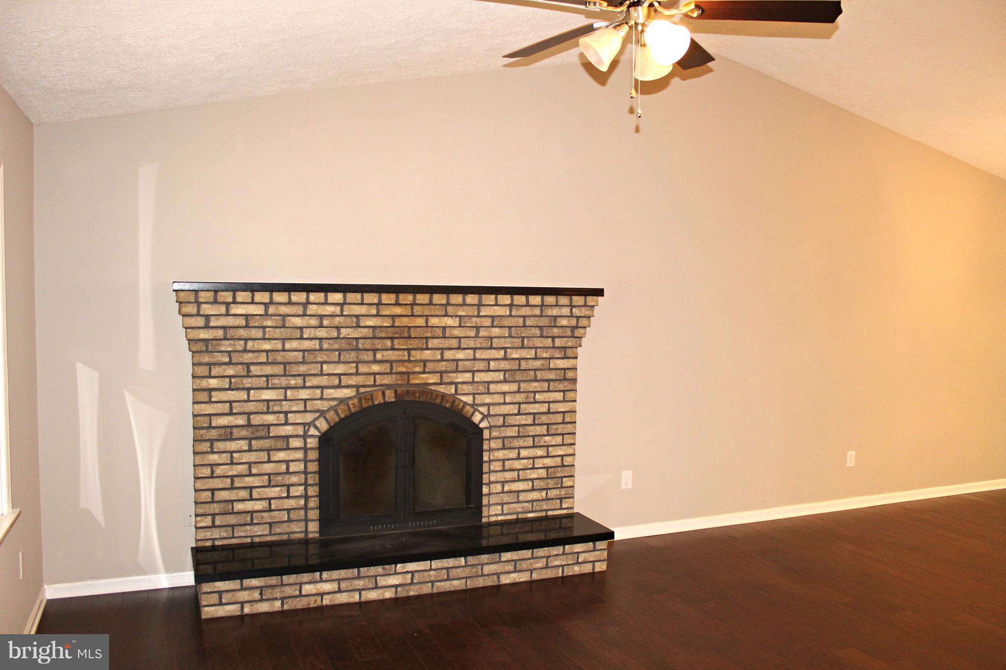 668 San Gabriel Road Lusby, MD 20657 - Photo 8 of 28 Fireplace and Hardwood Flooring in Living Room!