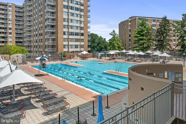 a view of a patio with a table and chairs