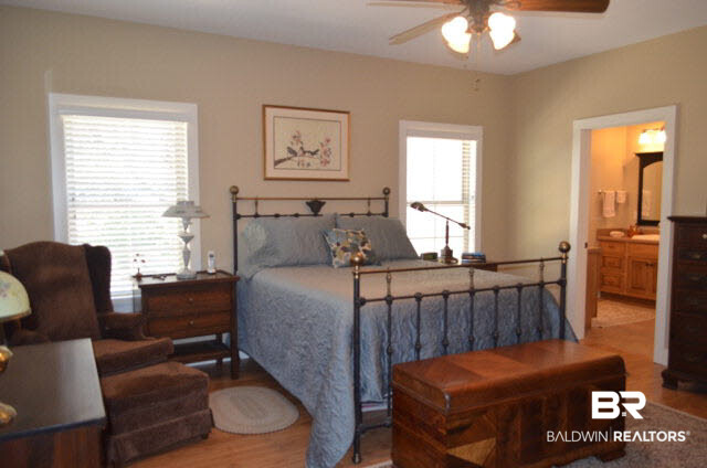 8919 Red Fish Pt Road Lillian, AL 36549 - Photo 21 of 46 HUGE master bedroom closet with a window for natural lighting.