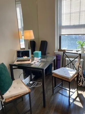 a workspace with furniture and window