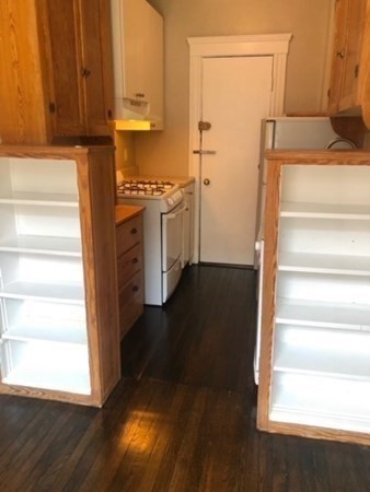 66 Queensberry Street, Unit 416 Boston, MA 02215 - Photo 7 of 18 a view of walk in closet with empty racks