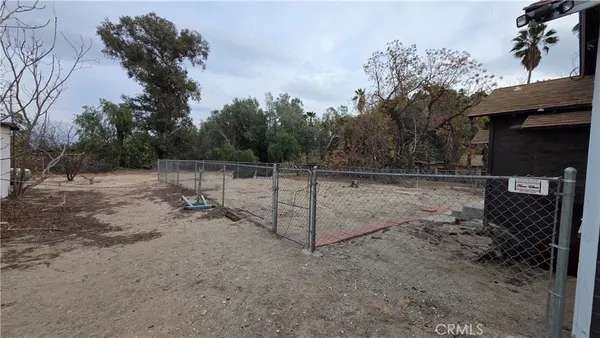 a view of a yard with car parked
