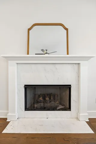 a kitchen with a dining table chairs stainless steel appliances and cabinets