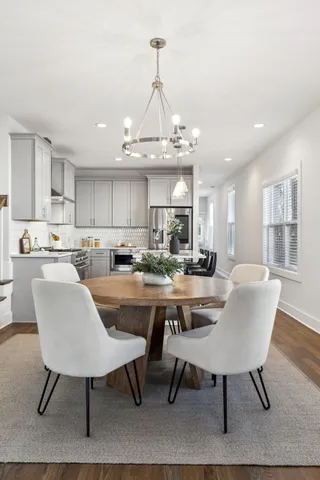a stove top oven sitting inside of a kitchen