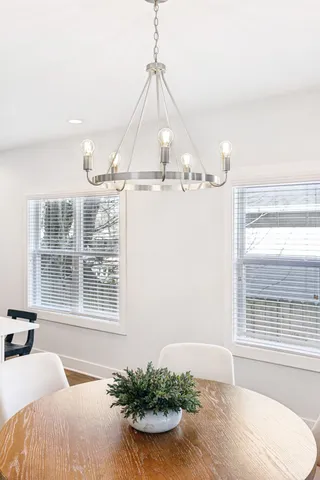 a view of a livingroom with furniture and a window