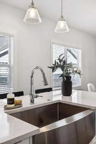 a bedroom with a bed and a lamp