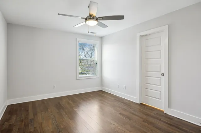 an aerial view of residential houses with city view