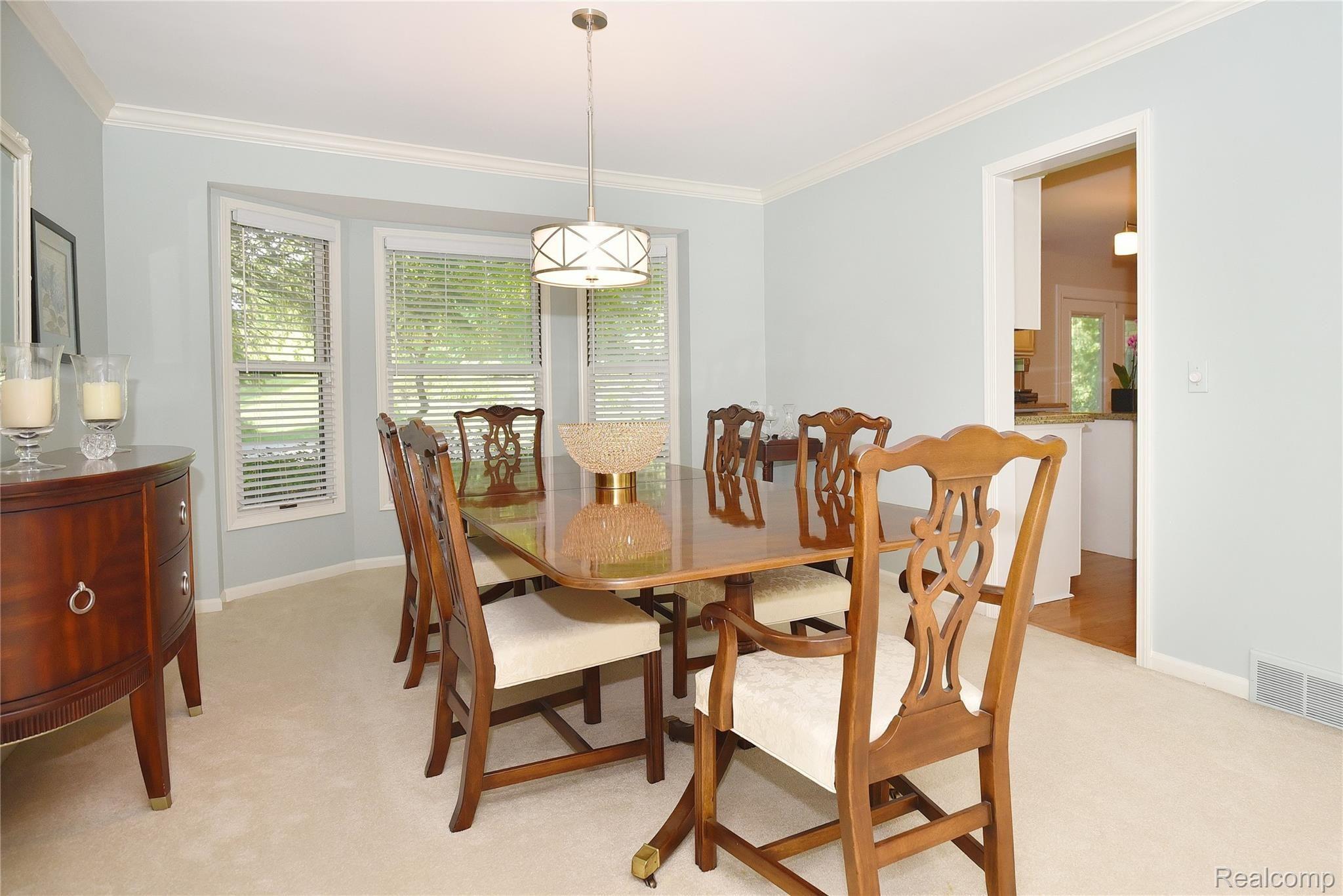1069 Springwood Lane Rochester, MI 48309 - Photo 12 of 37 Freshly painted Formal DR w/crown moldings