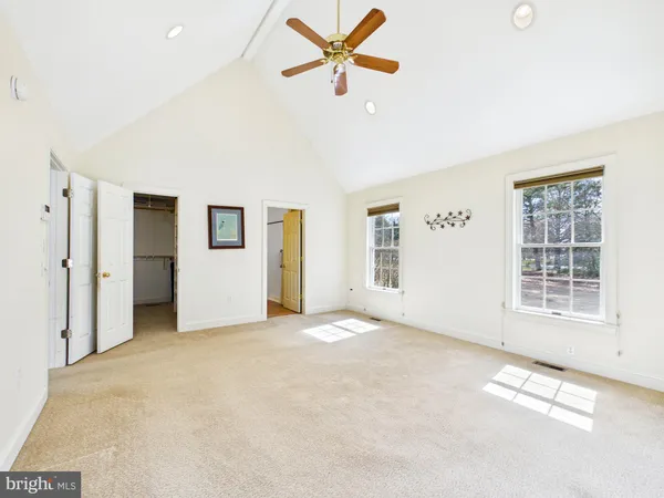 a living room with furniture and windows