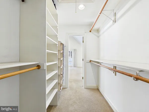 a view of a hallway with washer and dryer
