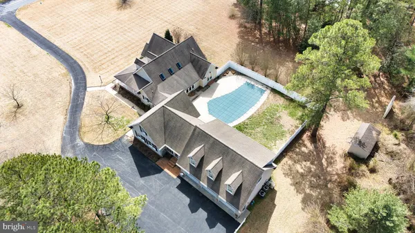 an aerial view of a house with a garden
