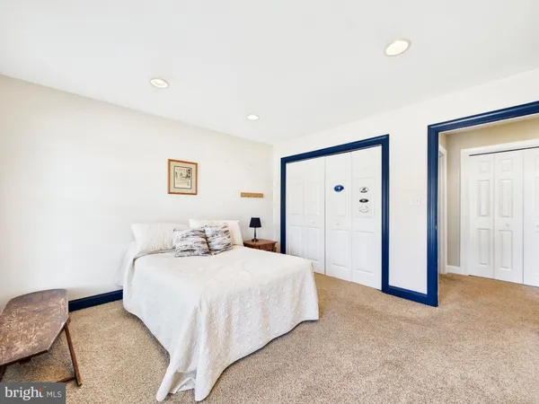 a view of a kitchen with closet and electronic appliances