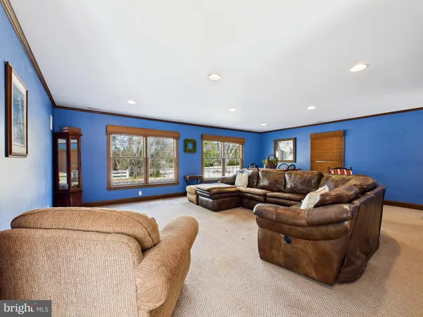 a bathroom with a bathtub sink and mirror