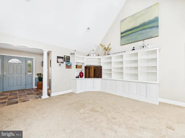 a view of a livingroom with furniture and lots of furniture