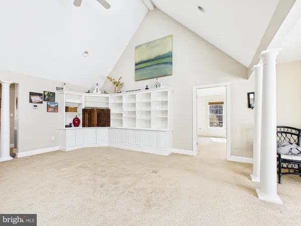 a living room with stainless steel appliances kitchen island granite countertop furniture and a kitchen view