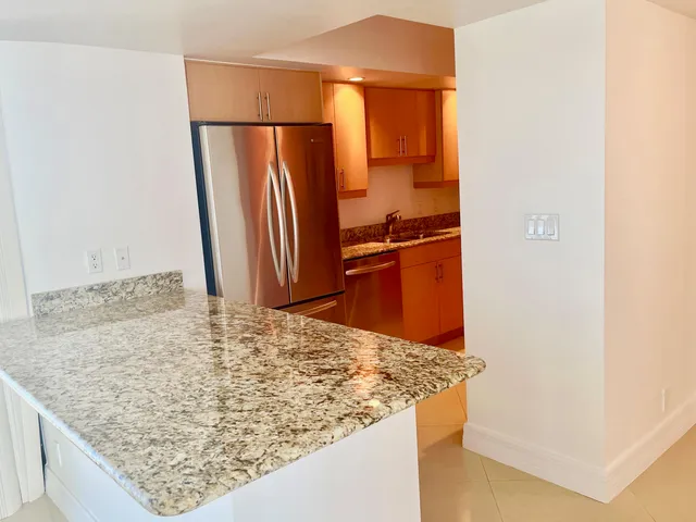 a kitchen with a white stove top oven and sink
