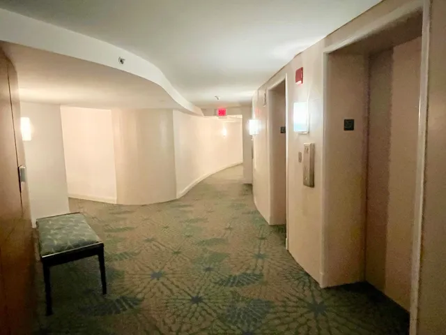 a dining room with furniture window and wooden floor